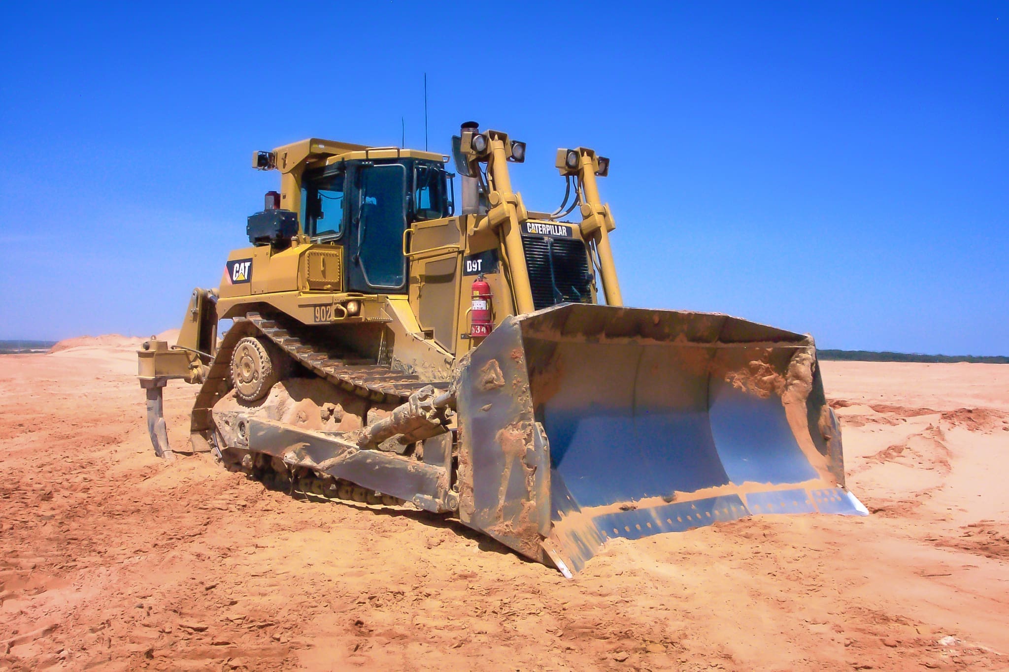 Dymax reclamation U-blade on a Caterpillar D9T track dozer, pushing overburden on a mine reclamation site