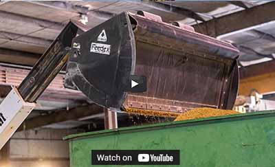 Hydraulic Pushout / Ejector Bucket Ram System Dymax Pushout wheel loader bucket showing hydraulic ejector ram and internal wiper system for clean material discharge